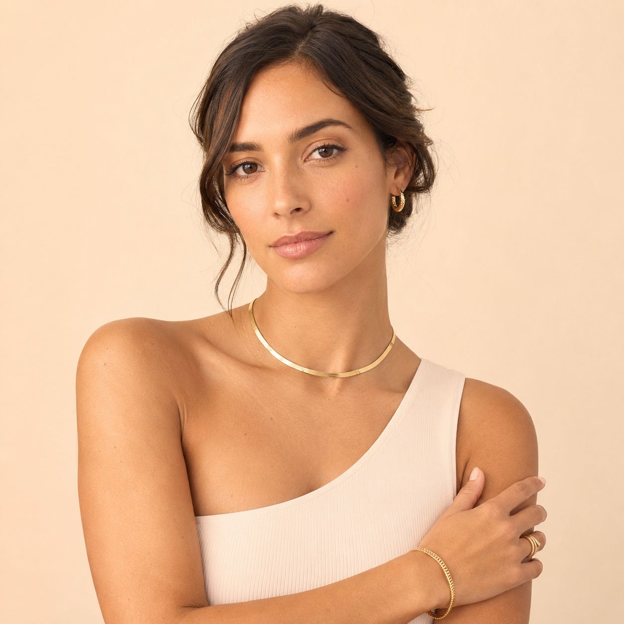Model wearing a 14K gold herringbone choker, Fremada fine jewelry